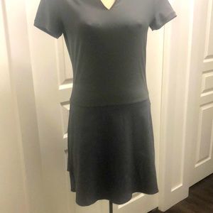 This gray Nike golf dress has flowing skirt in the back.
